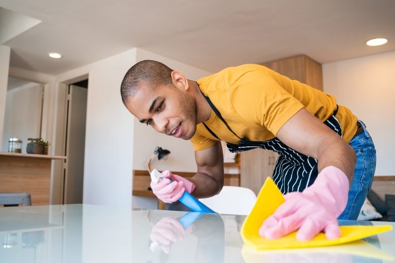 close-up-of-young-latin-man-cleaning-stains-off-th-2026-01-11-09-42-18-utc